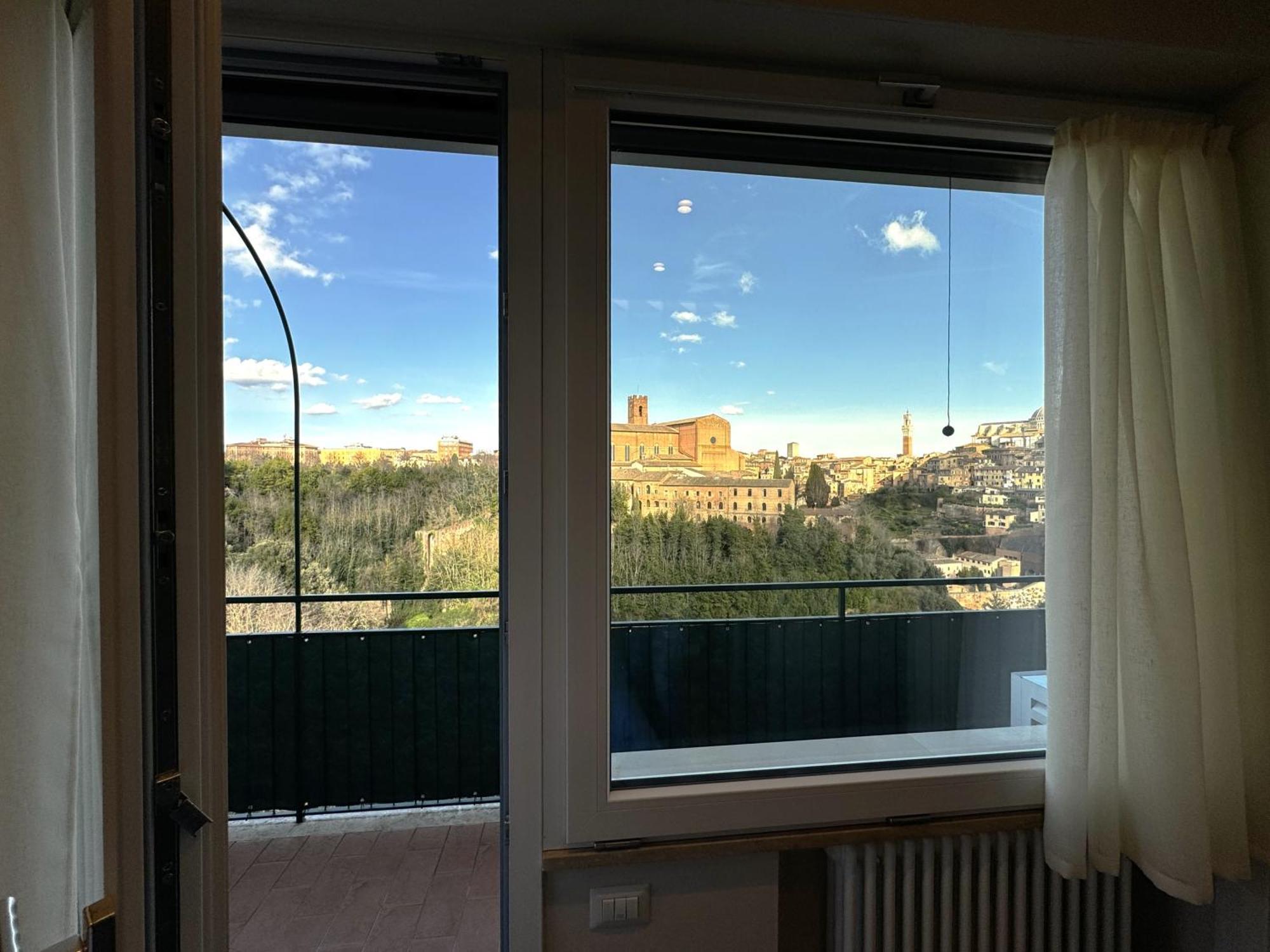 Skyline Siena Apartment Bagian luar foto